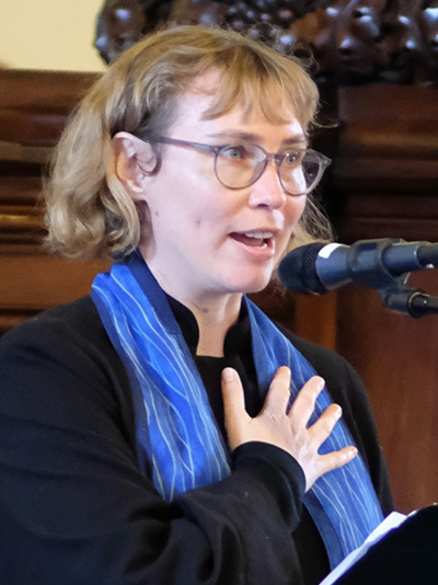 a portrait of Rev. Elizabeth “EB” Bukey Saunter as she speaks during service