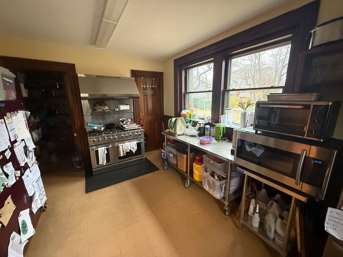 a view of the commercial range, ovens, and work area in the Parish Hall kitchen