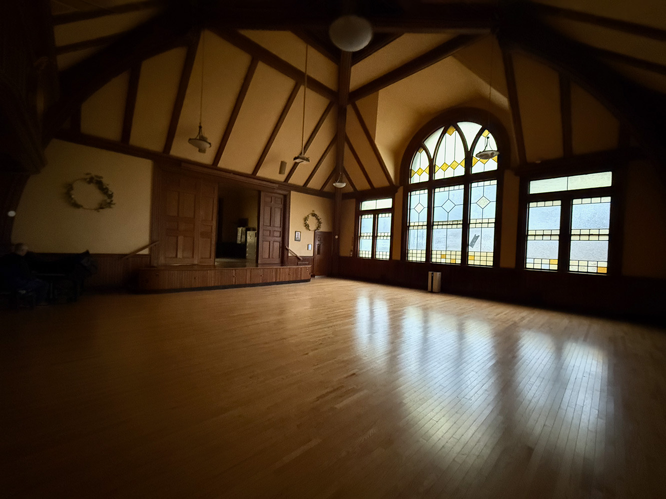 a view of the Main Hall in the Parish Hall with the stage doors partially open