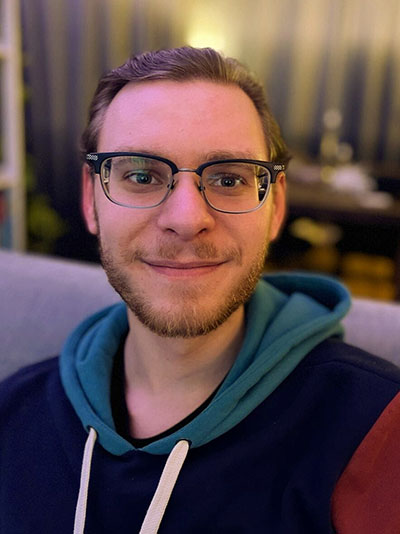 a portrait of Benjamin smiling